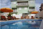 Family friendly apartments with a swimming pool Okrug Gornji