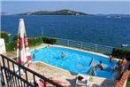 Seaside apartments with a swimming pool Seget Vranjica
